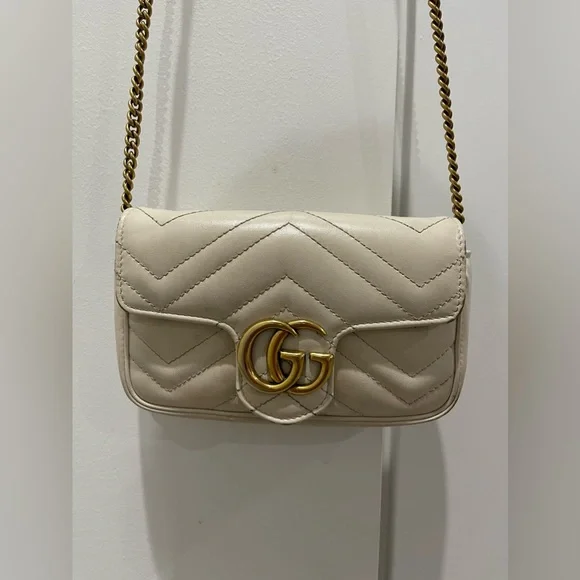 Gucci purse white and gold shop